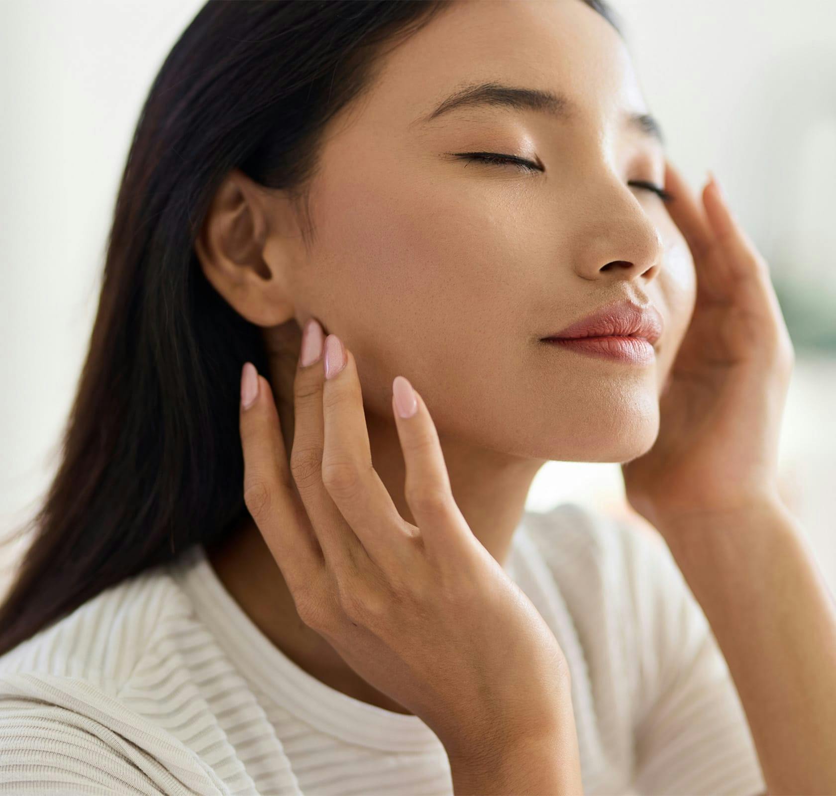 woman with hands on her face