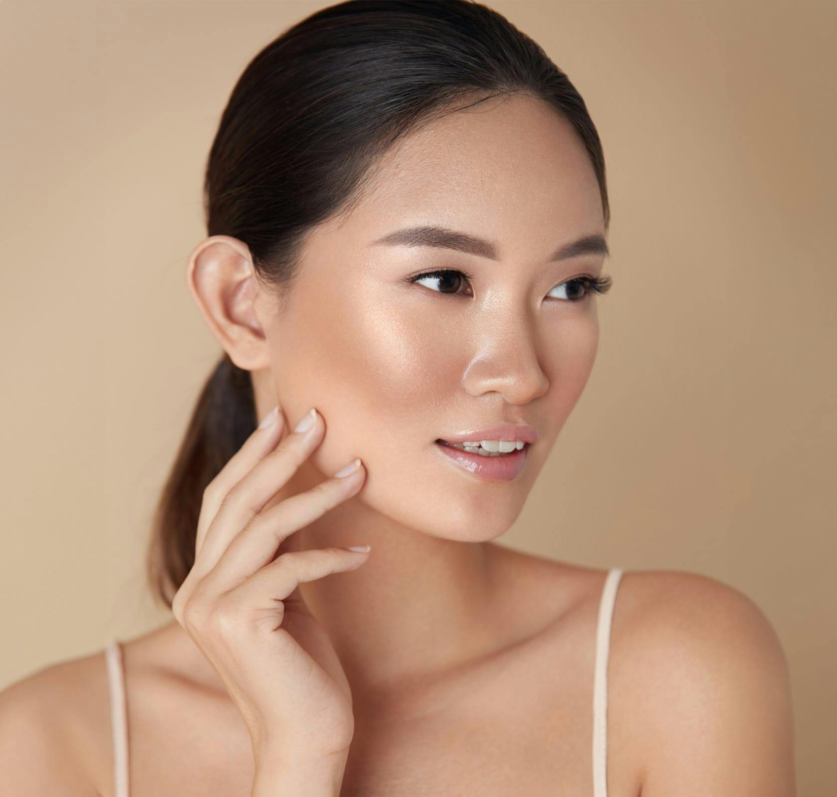 woman with hand on her face