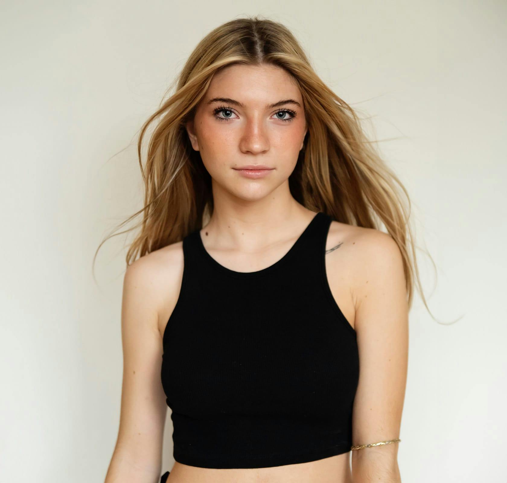 blonde woman looking at camera