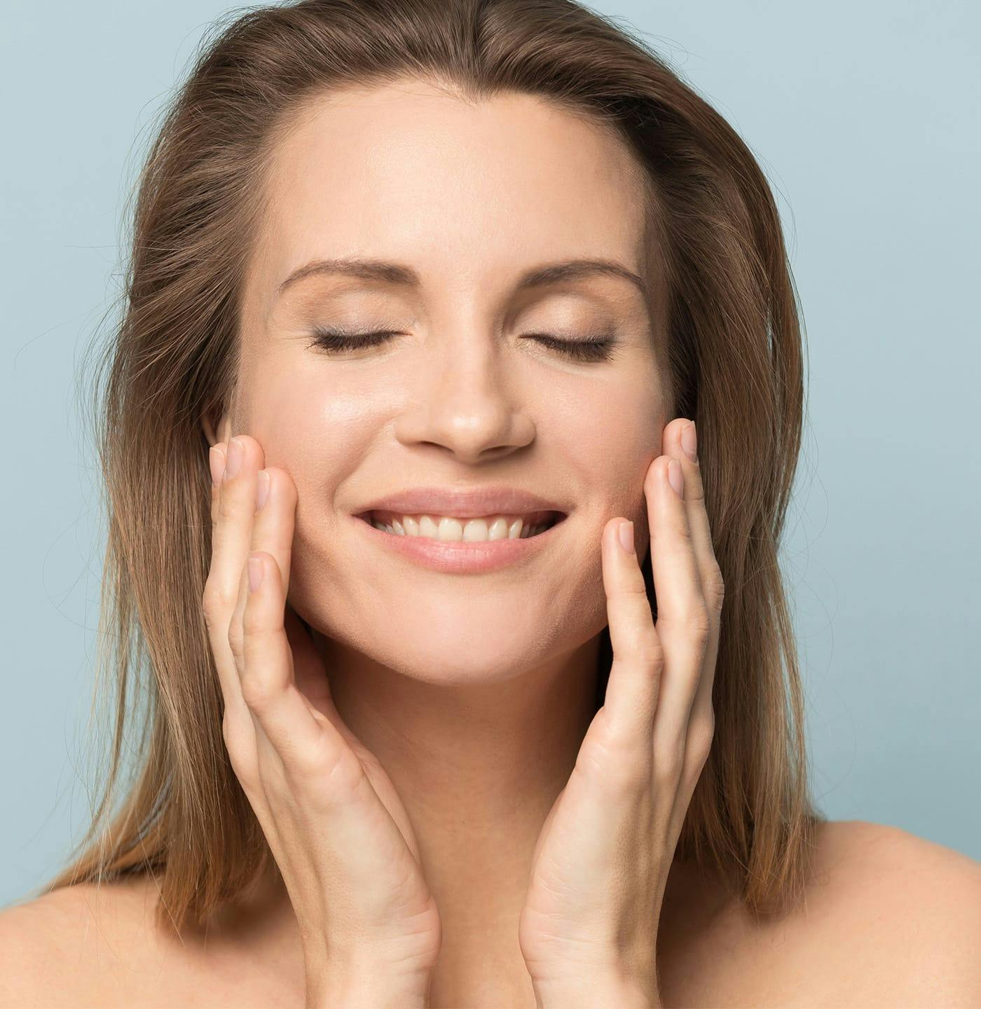 Woman touching the sides of her face