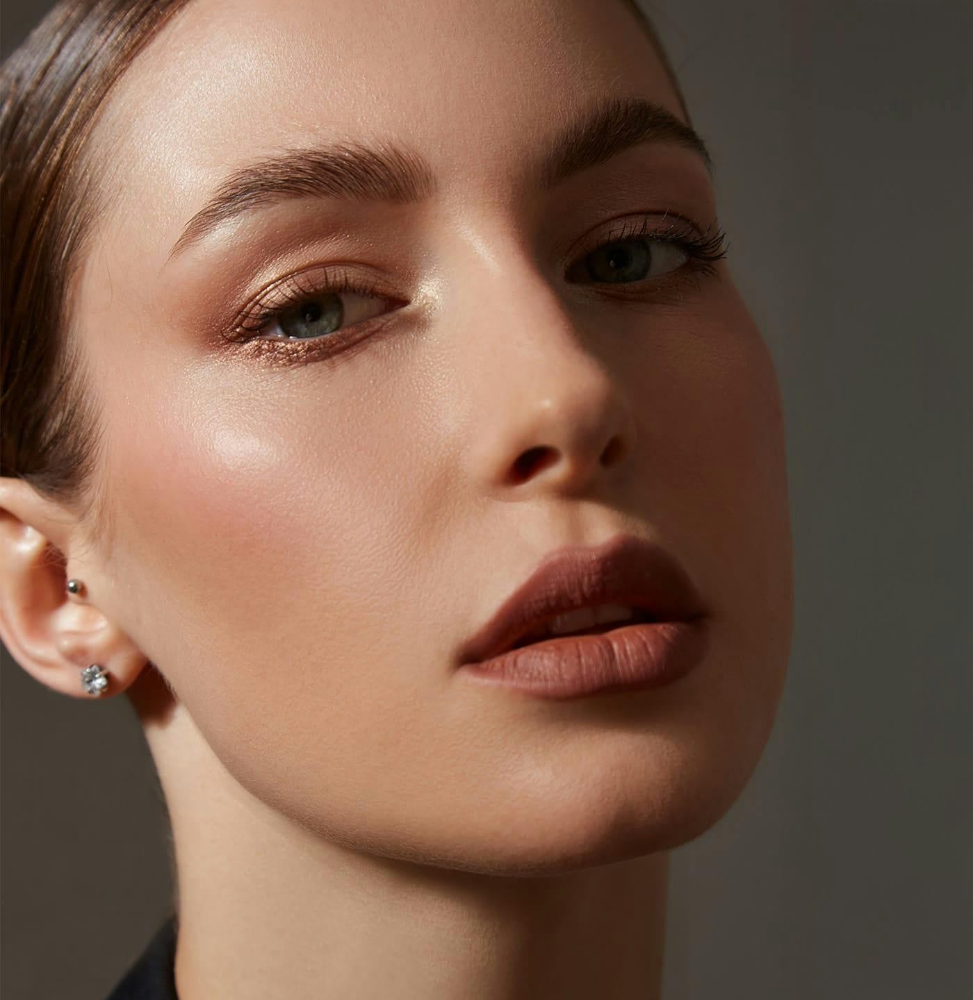 Woman with her hair slicked back