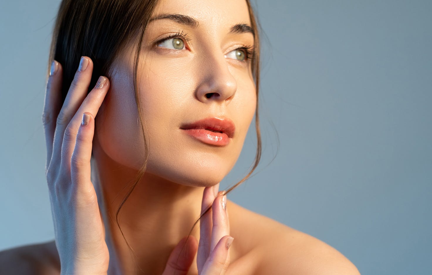 Woman touching the side of her face