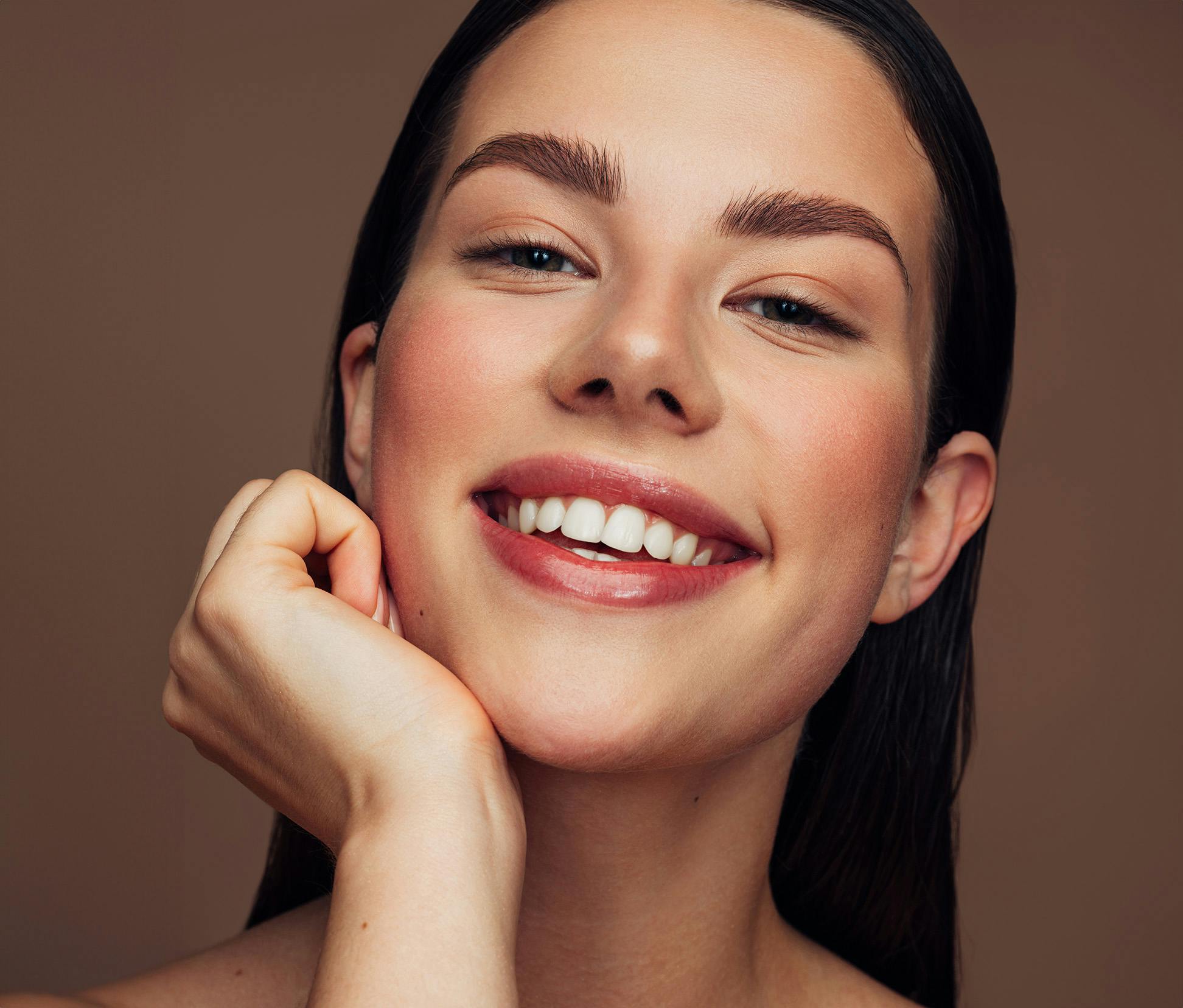 Woman resting her face on her hand