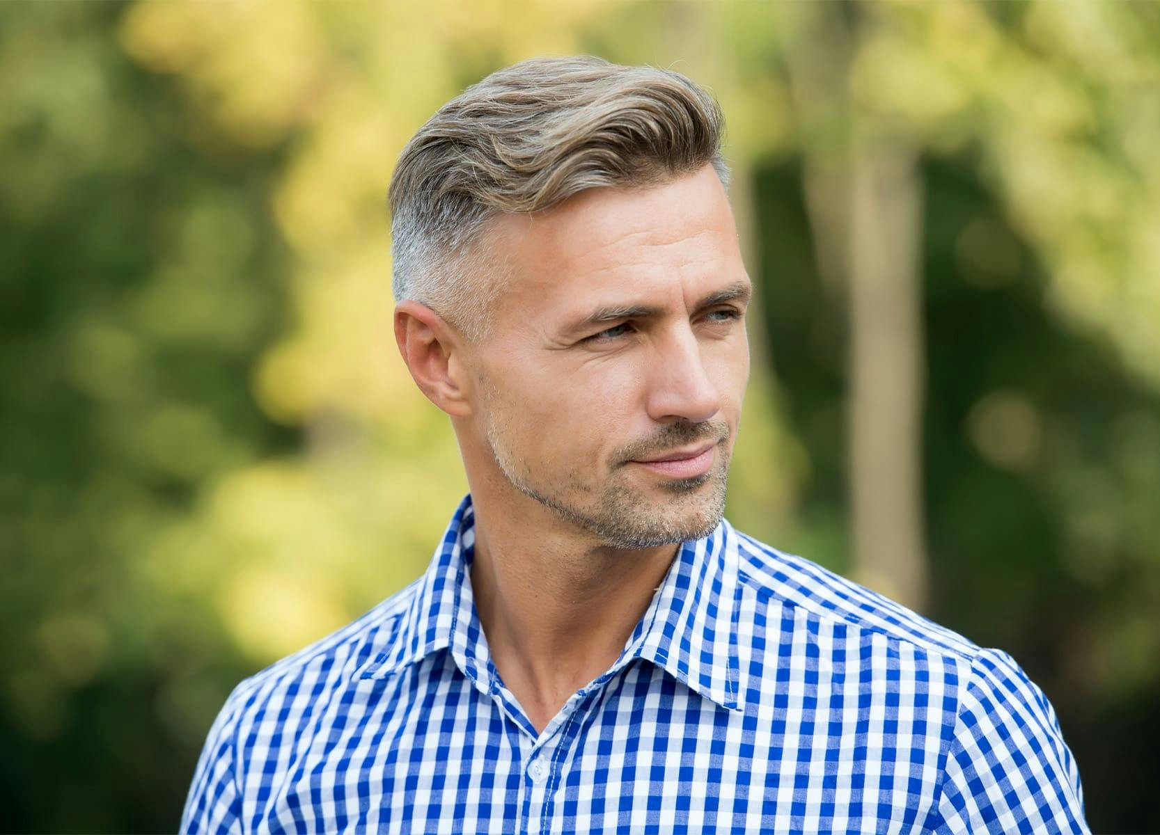 Man in blue shirt outside