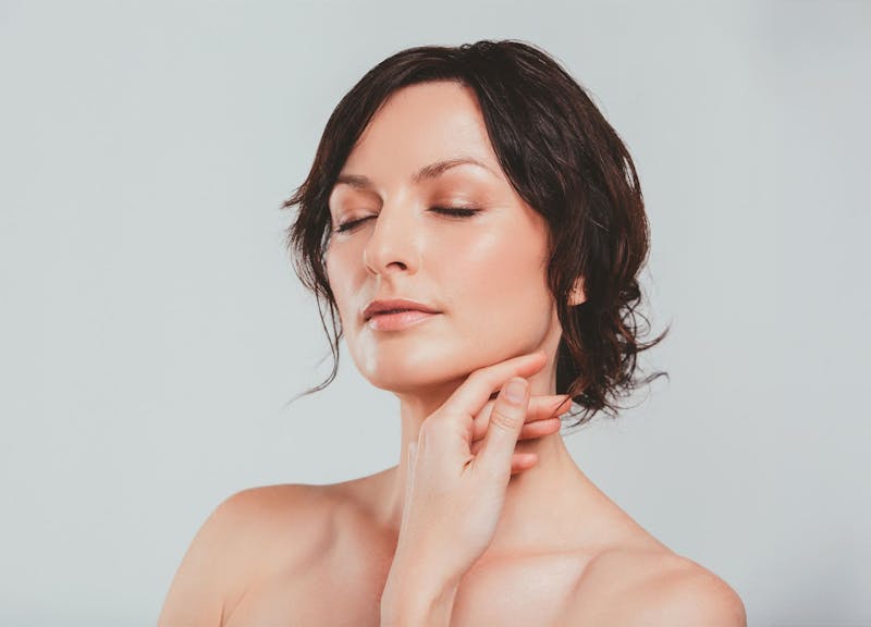 Woman touching her face