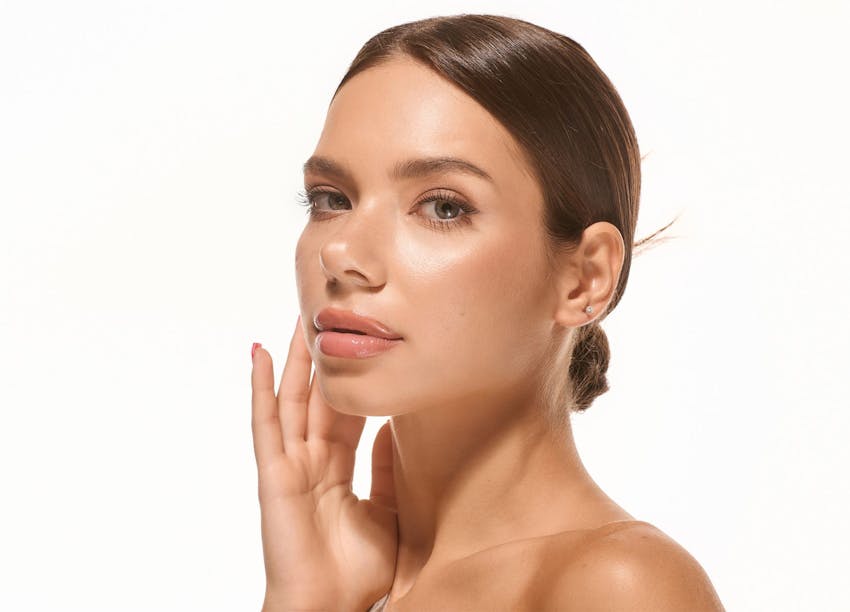 Woman touching her face