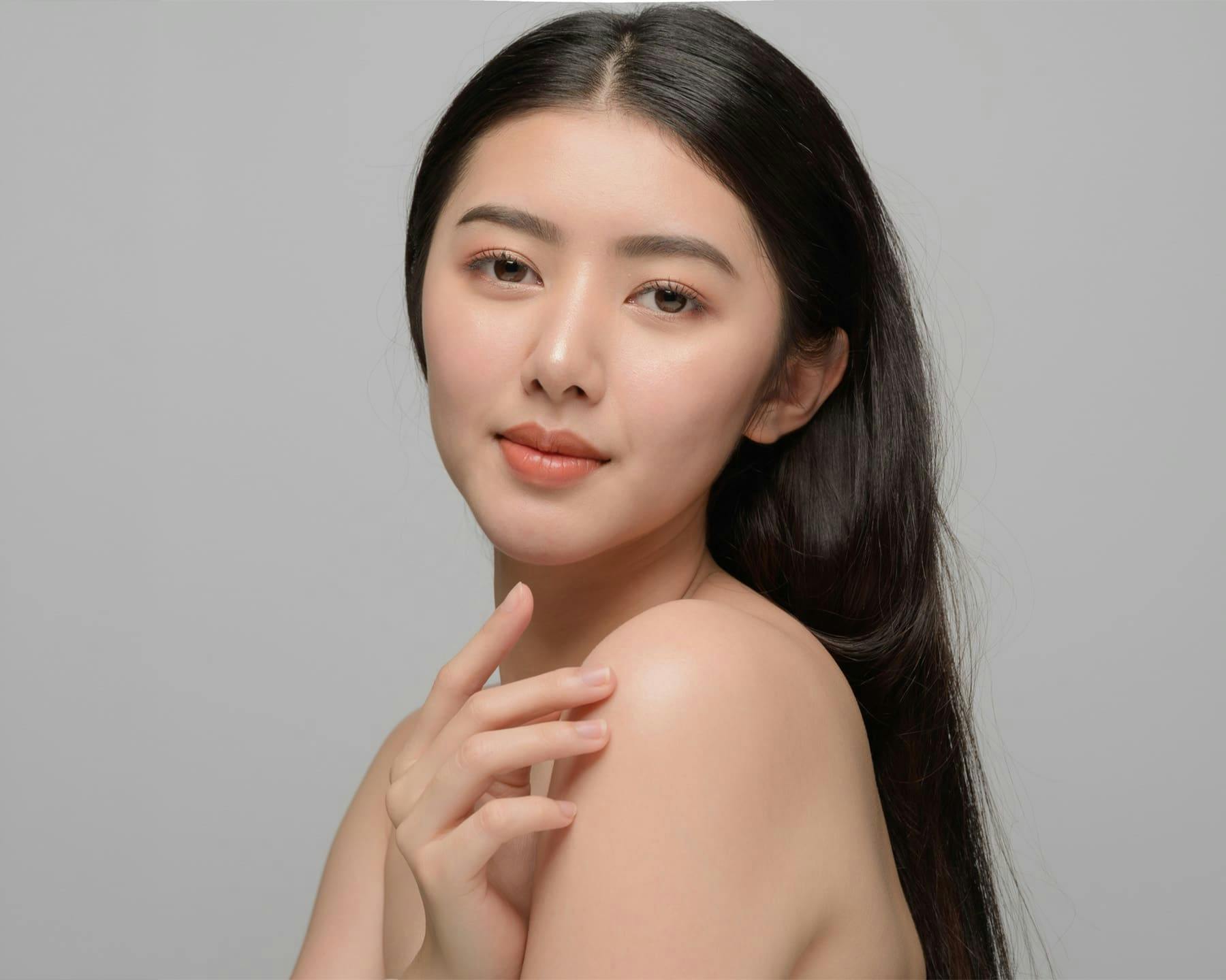 woman touching her shoulder