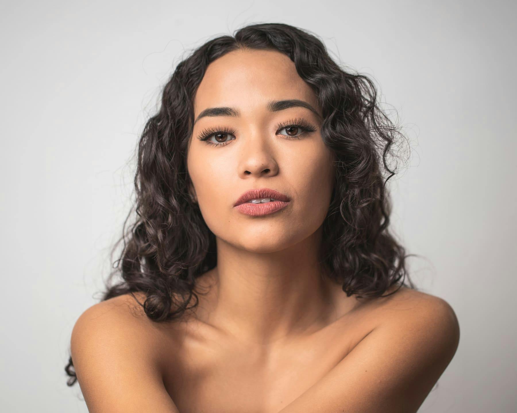 Woman pursing her lips