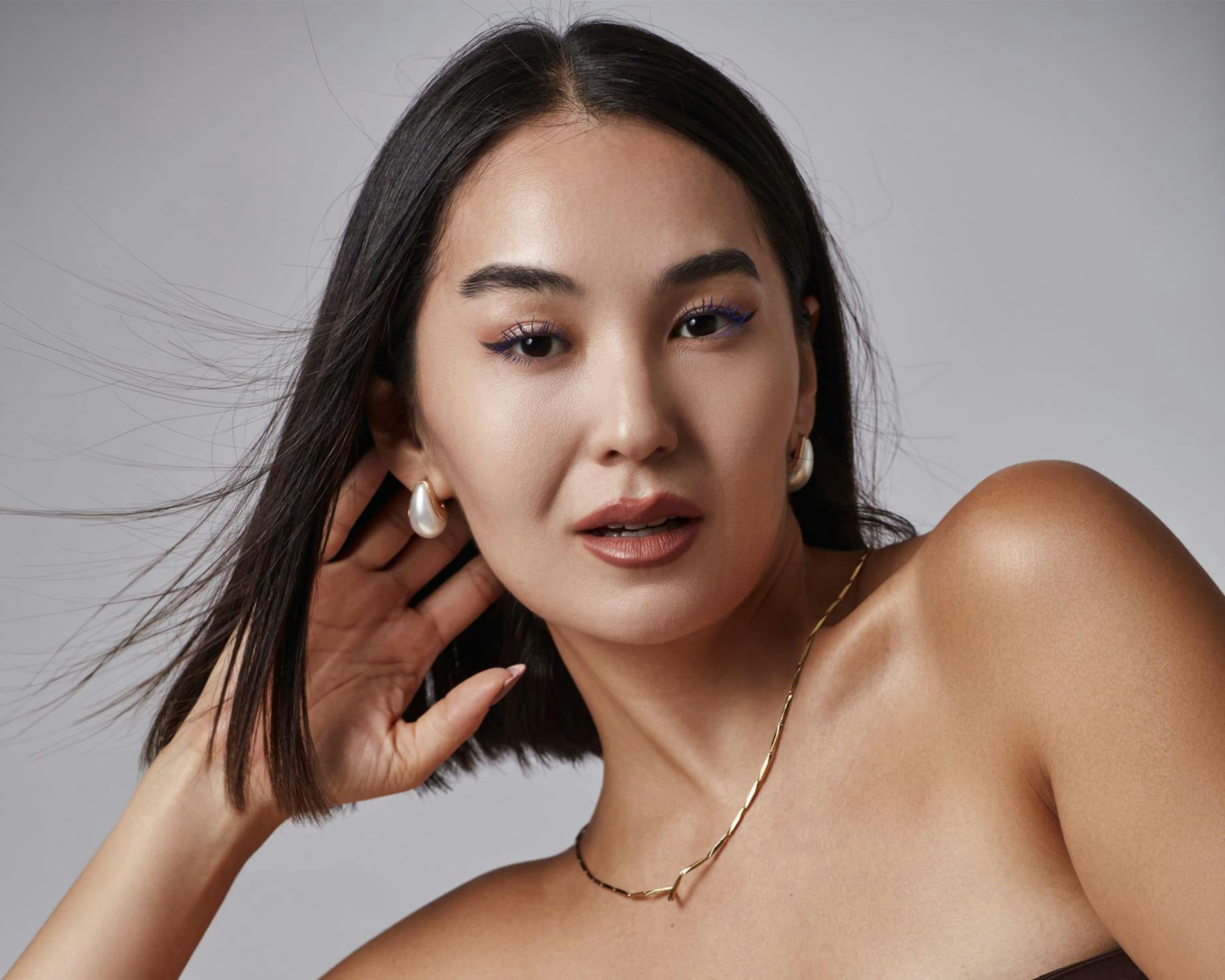 Woman with her hand on her neck