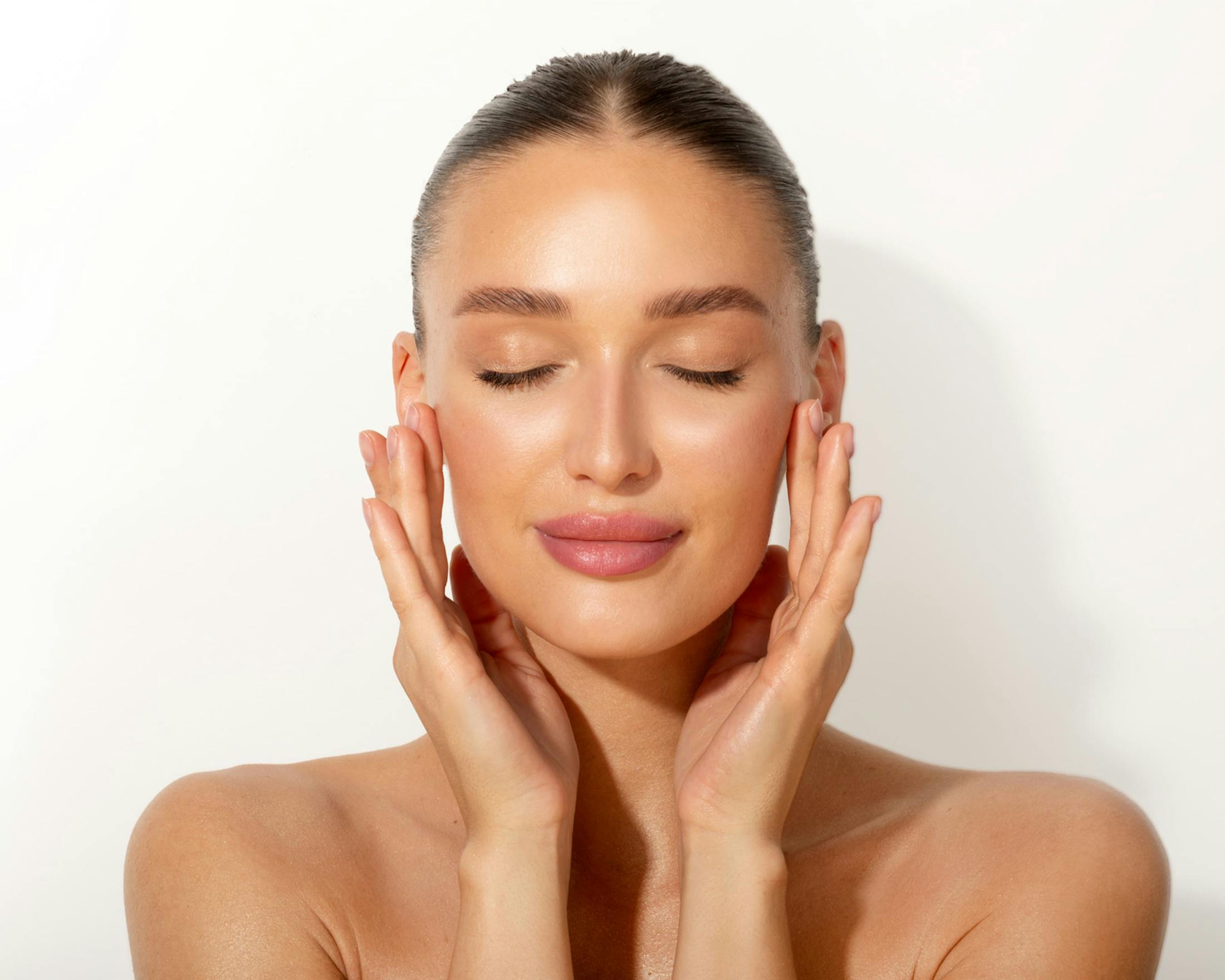 Woman touching her face