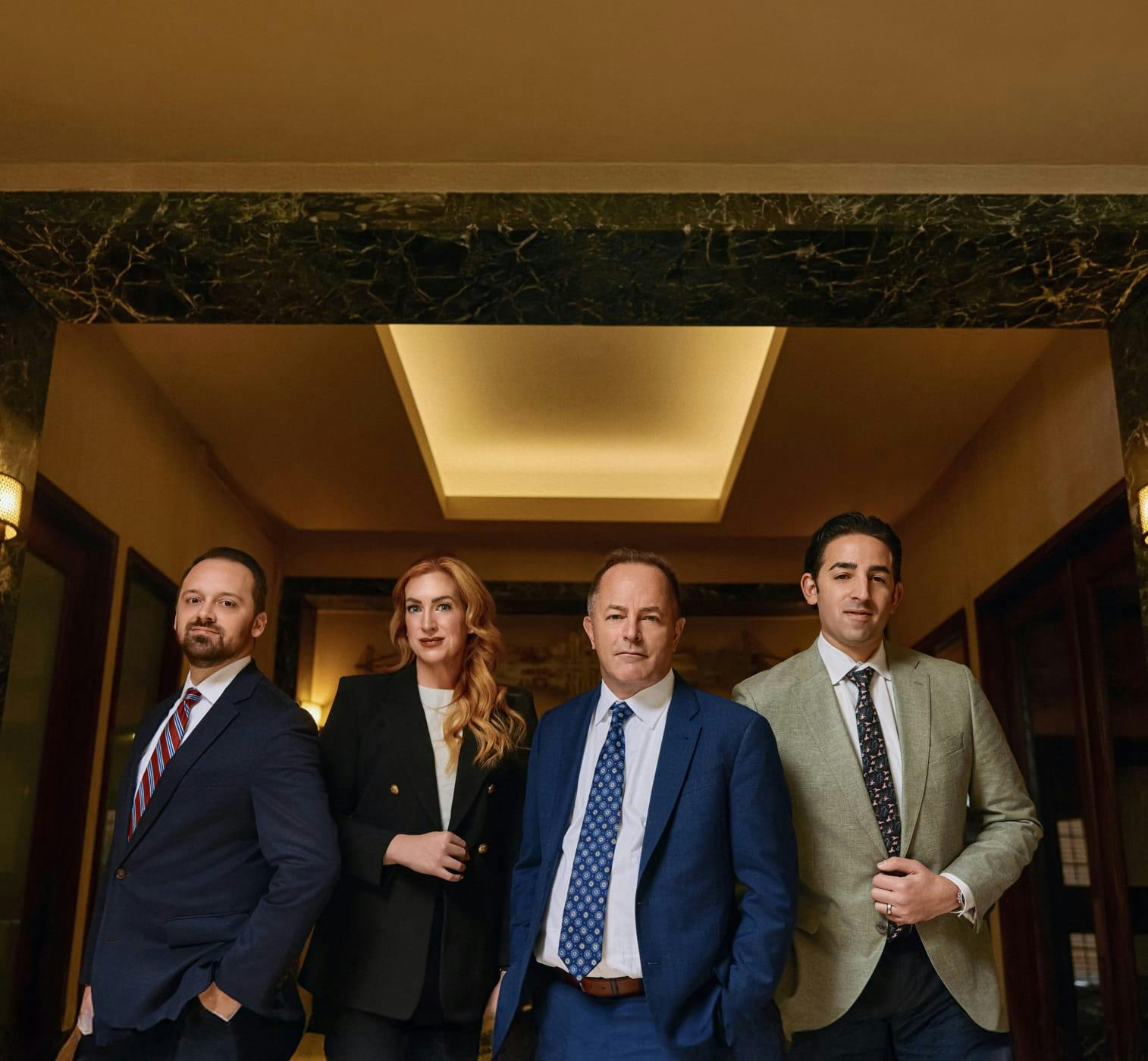 four attorneys standing together