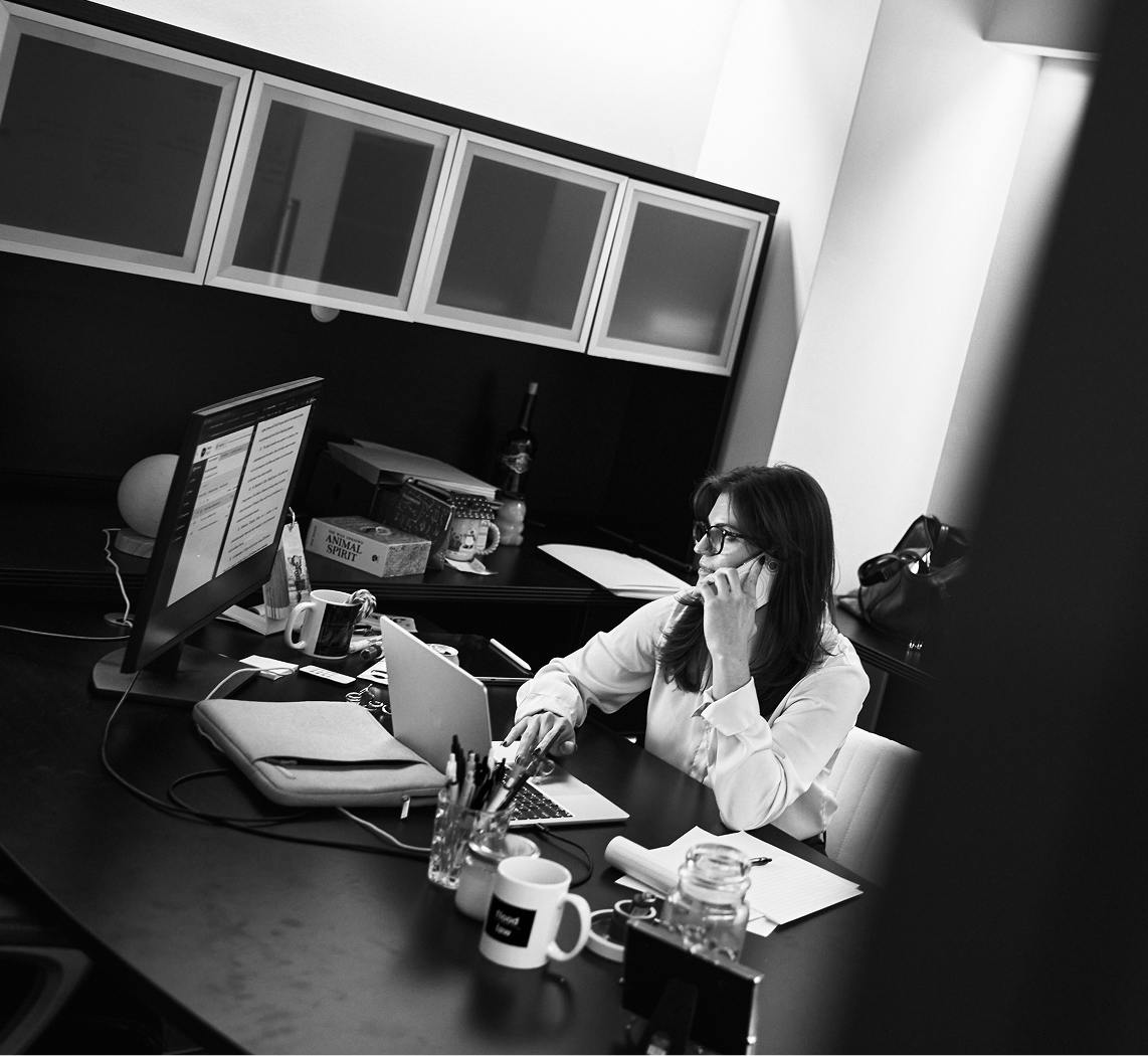 Lawyer at a desk looking at a computer