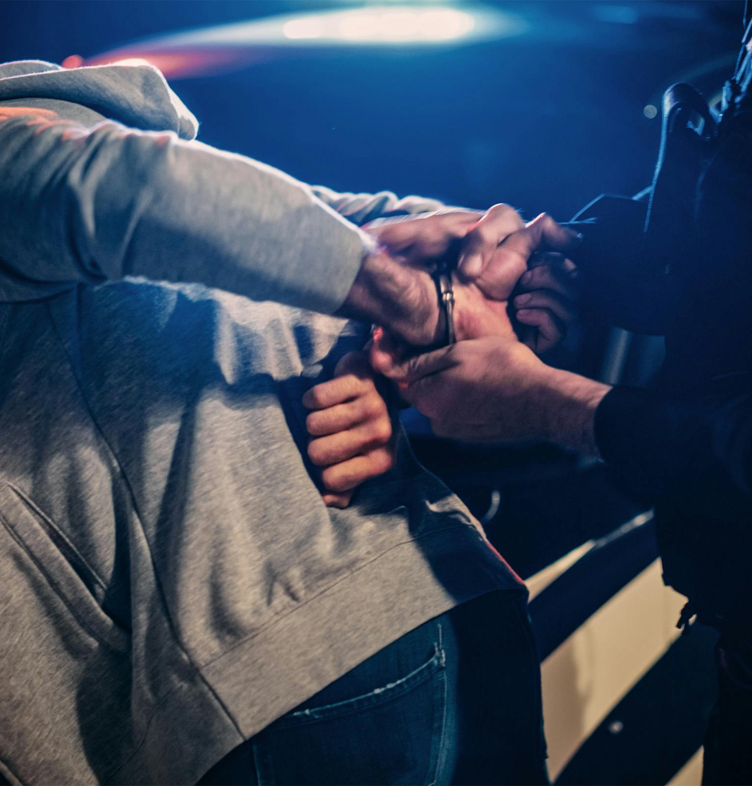 Person in handcuffs being mishandled by police