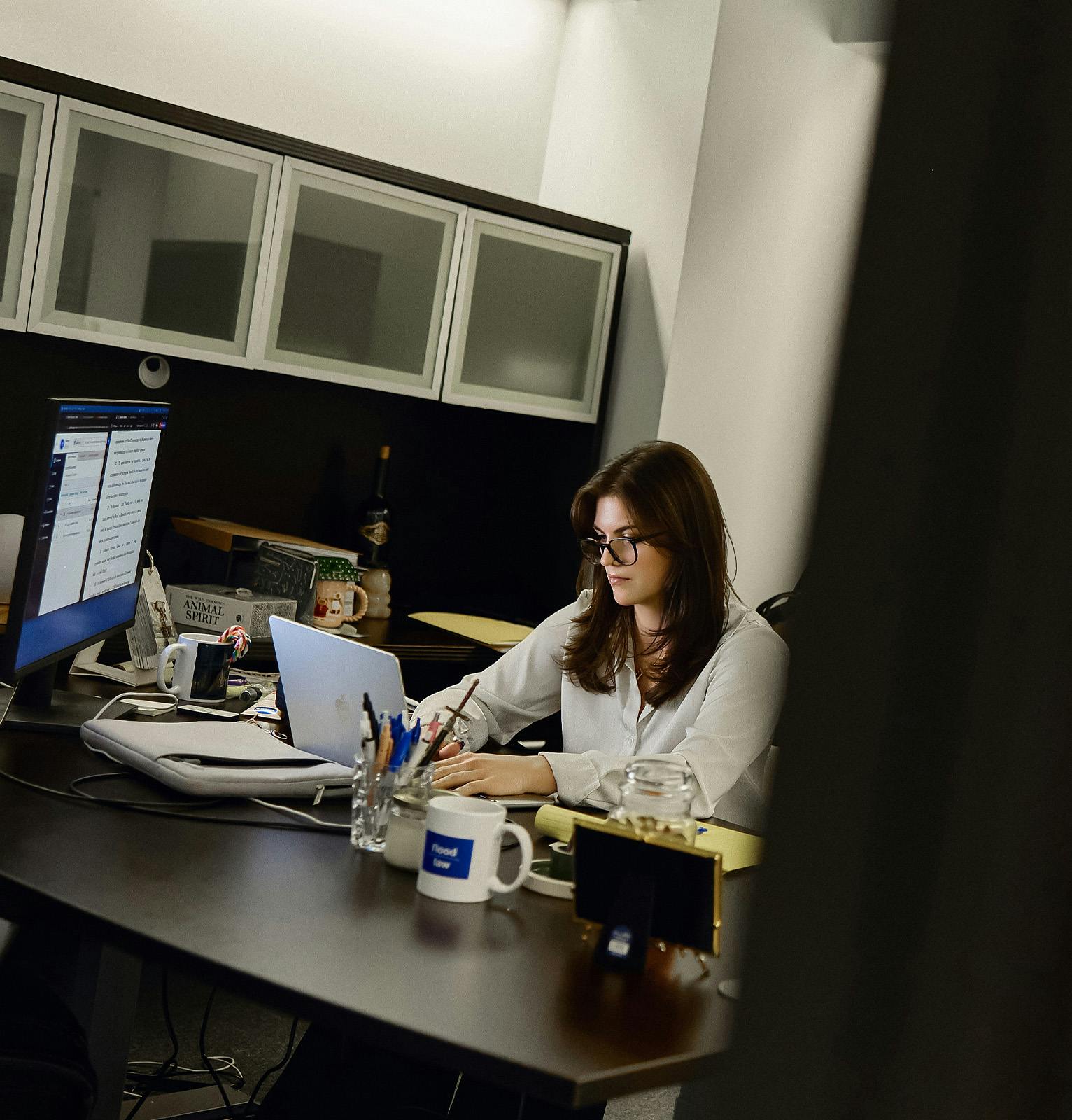 attorney typing on a laptop