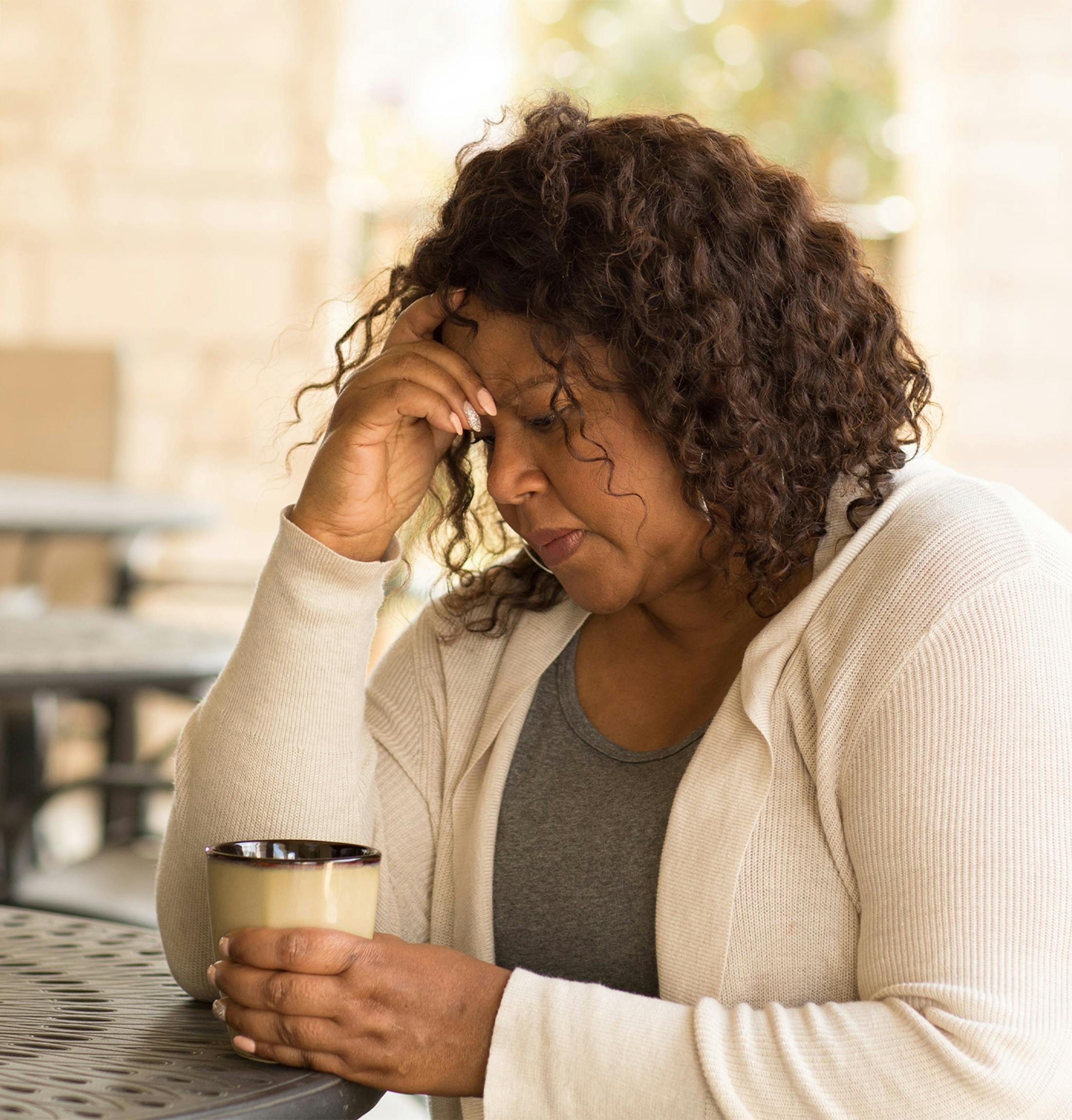 woman with her face in her hands