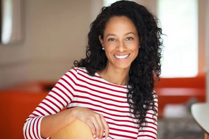 smiling woman with striped top