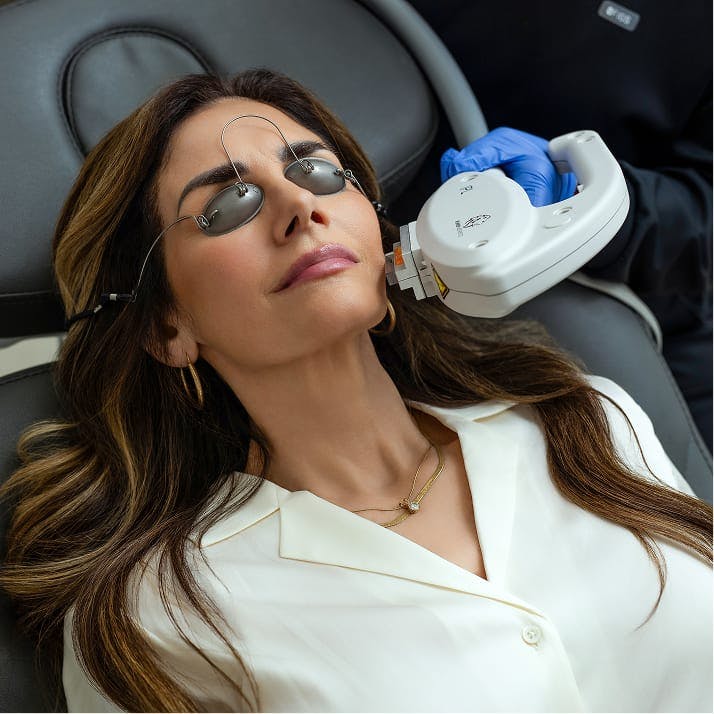 woman getting face treatment