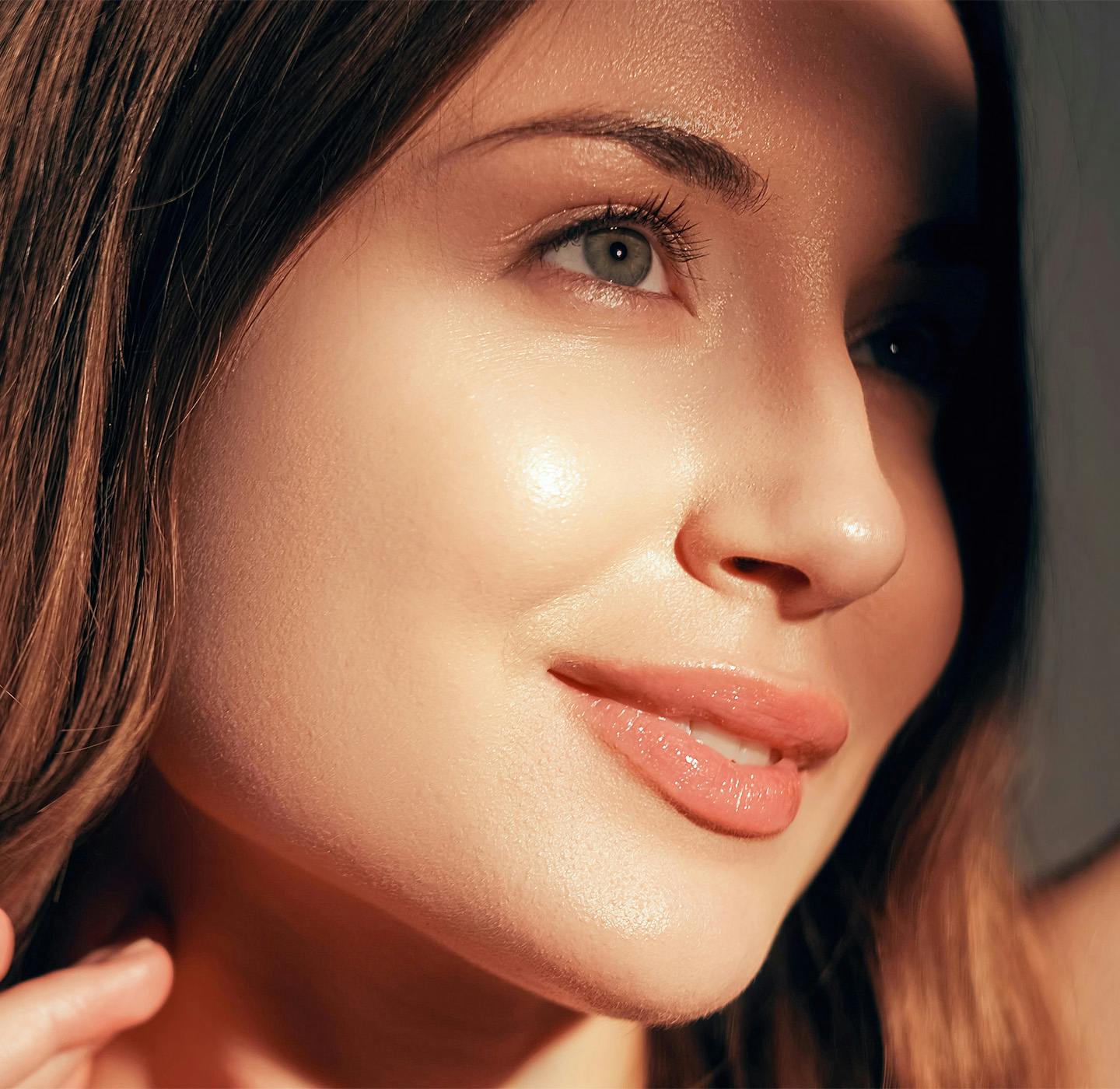 Women soft smiling into light