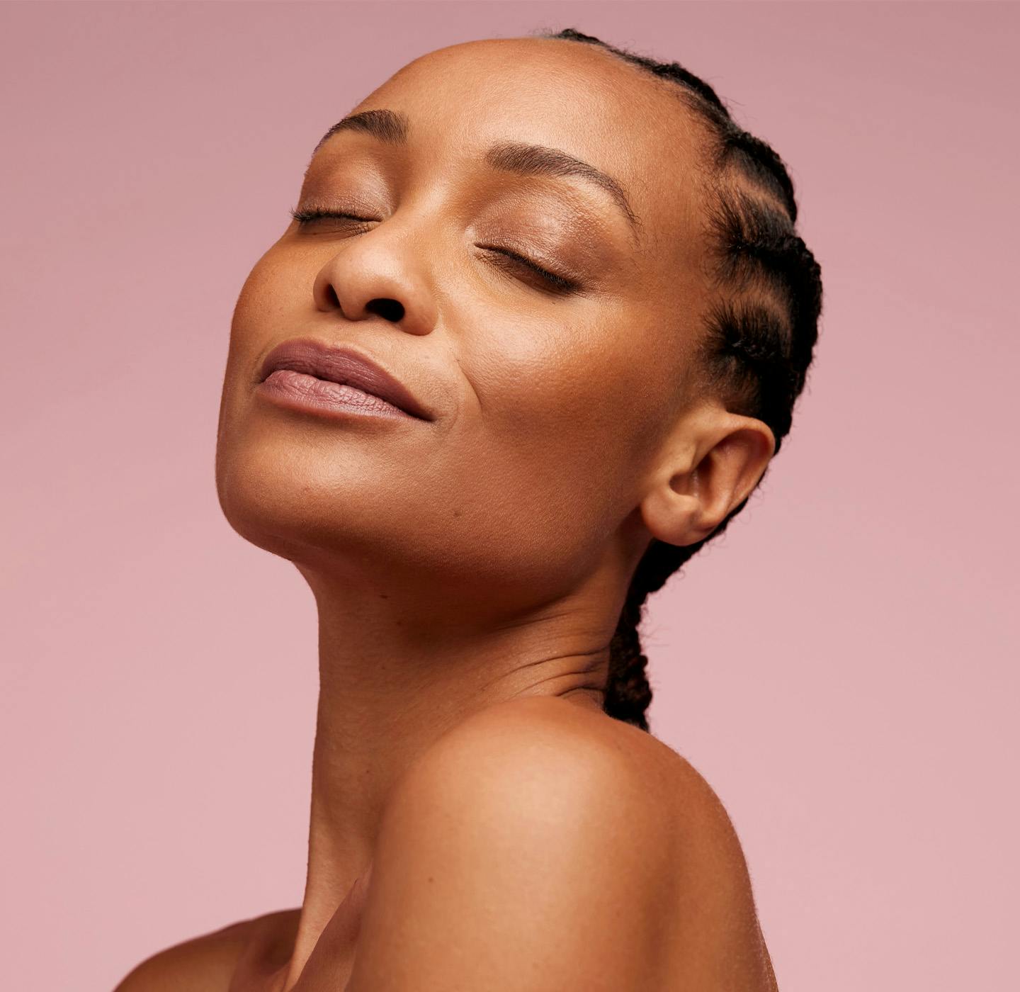 woman smiling with her eyes closed
