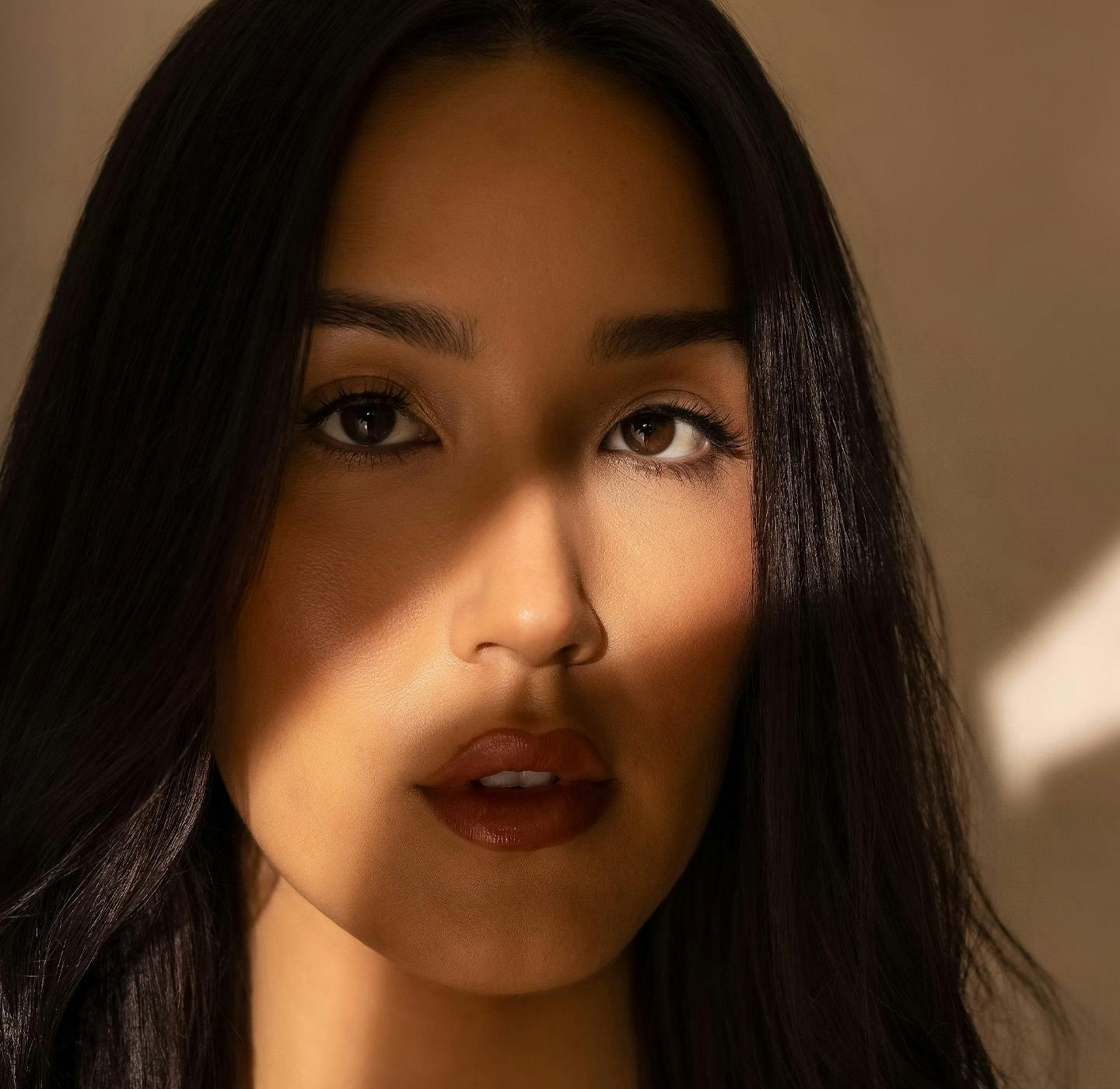 light beam across a woman's face