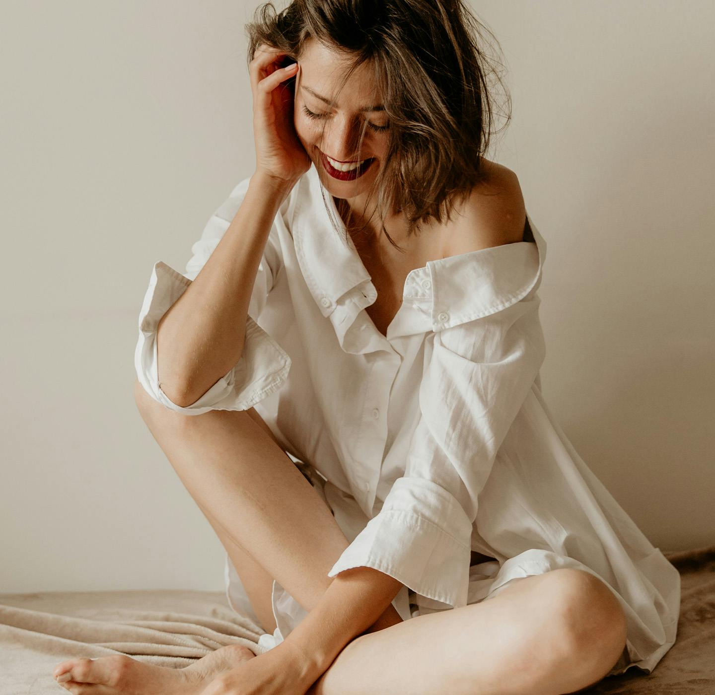 Women sitting hand in hair