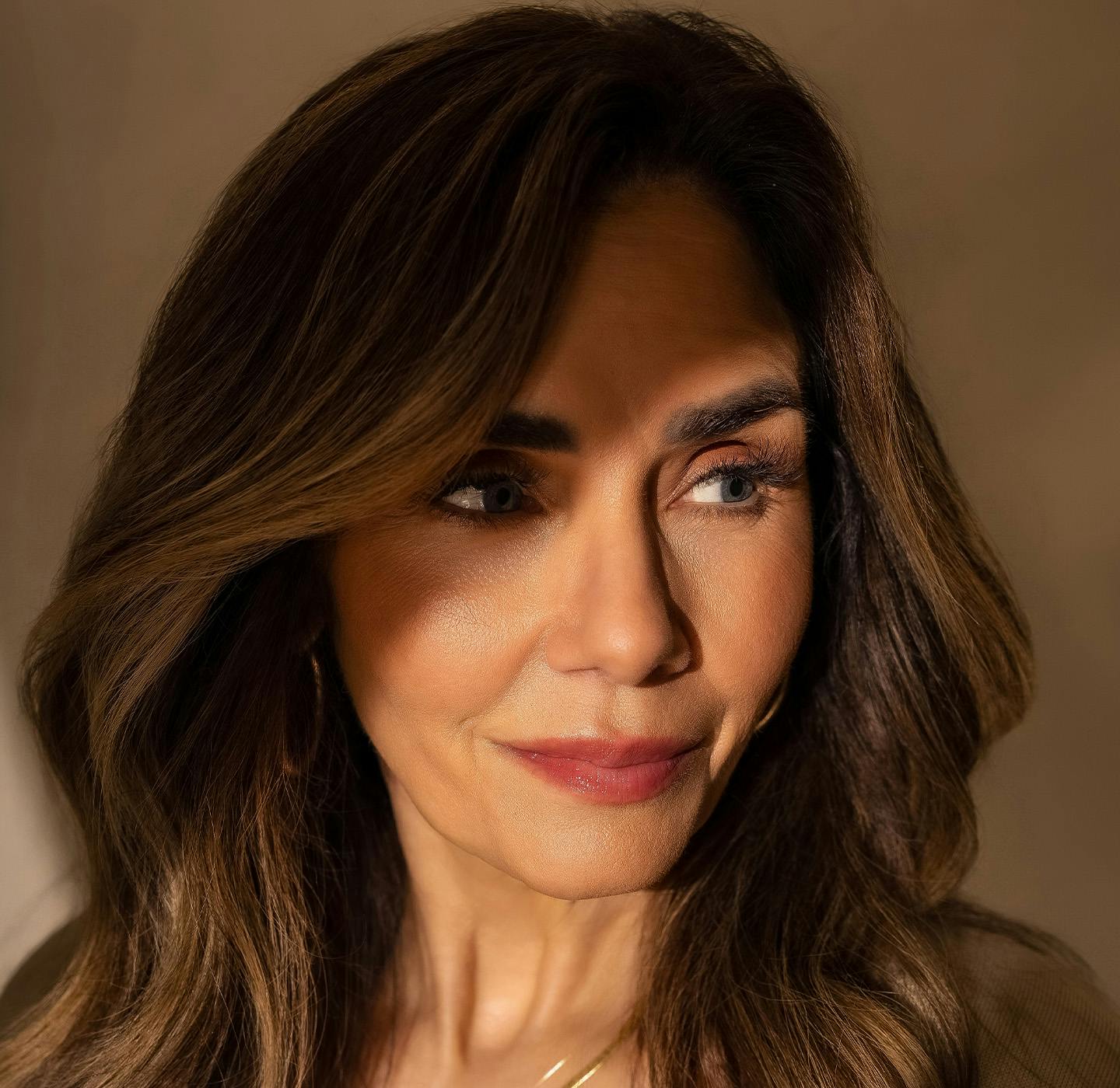 woman with light beams across her face
