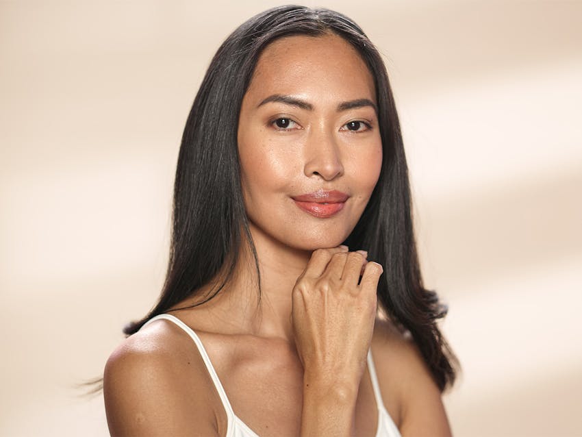 woman touching her chin