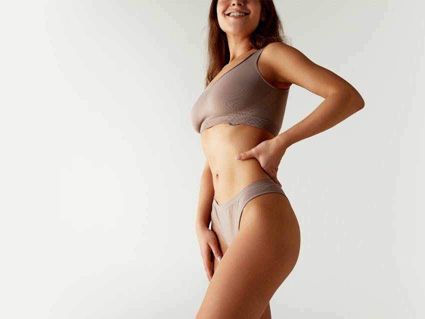 Women standing hand on back
