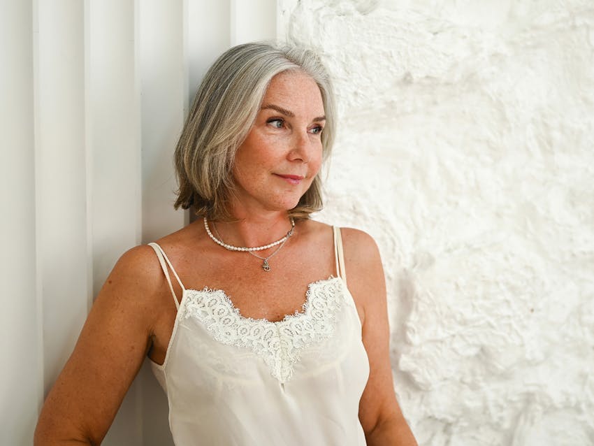 woman leaning against wall