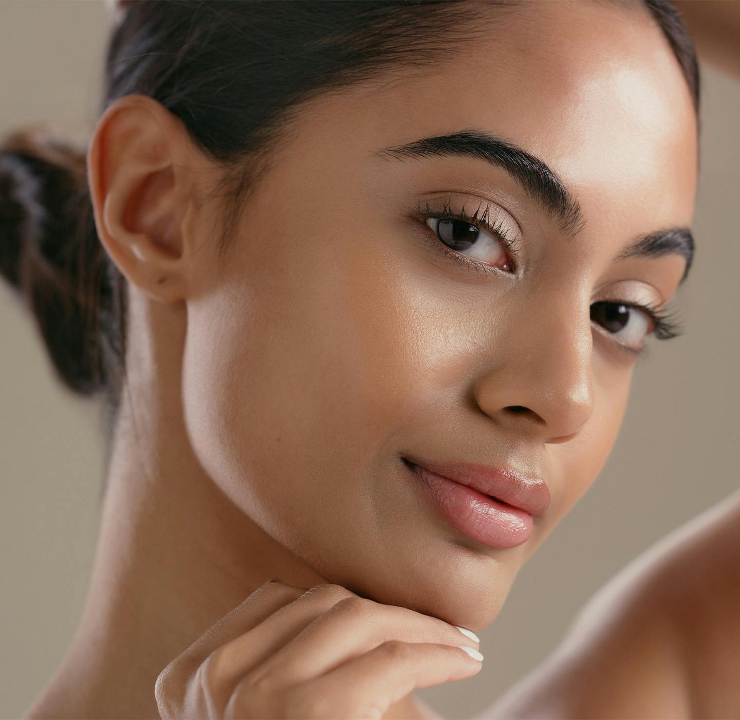 woman with hand on chin