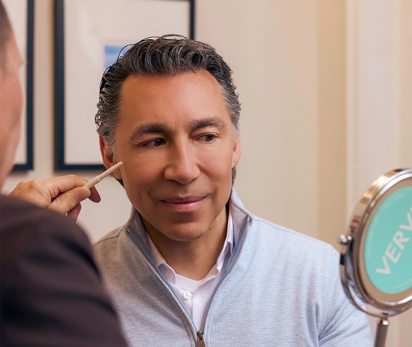 Man looking in a mirror
