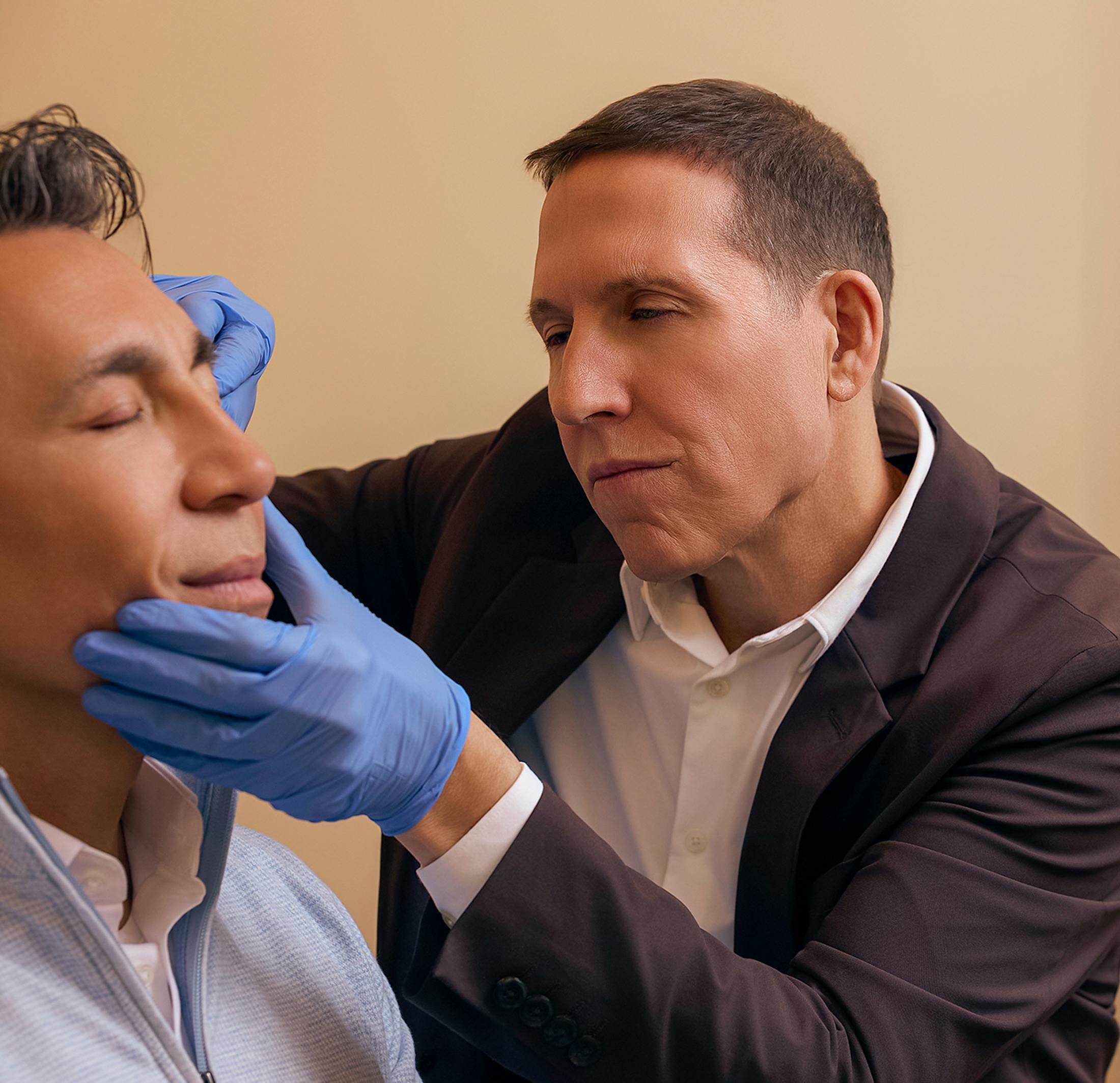 Doctor touching a man's face