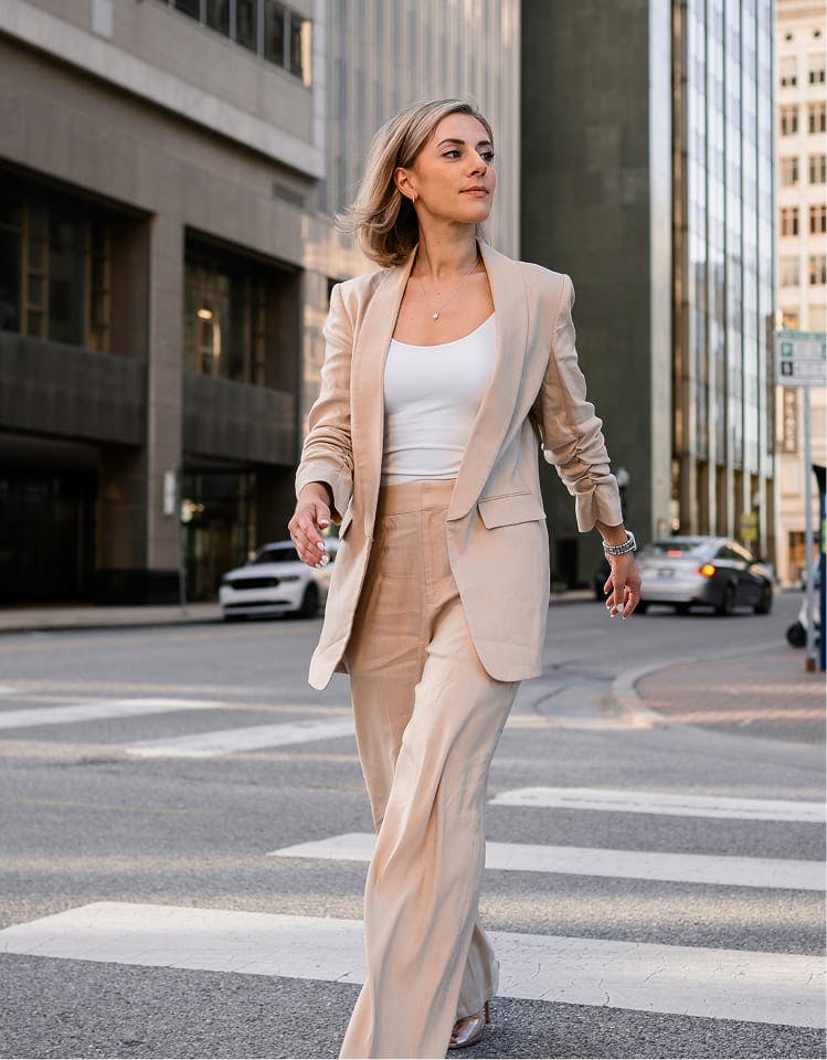woman walking across the street