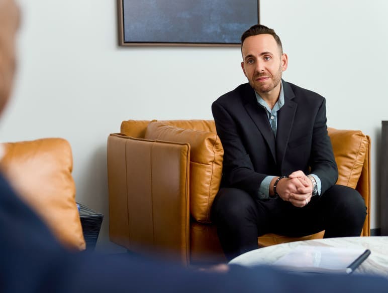 man in a suit in a meeting