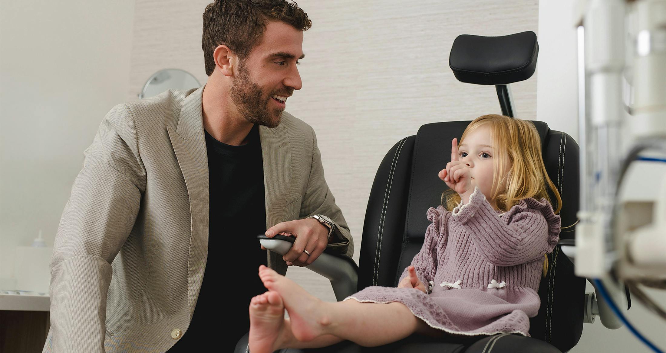Doctor helping a child