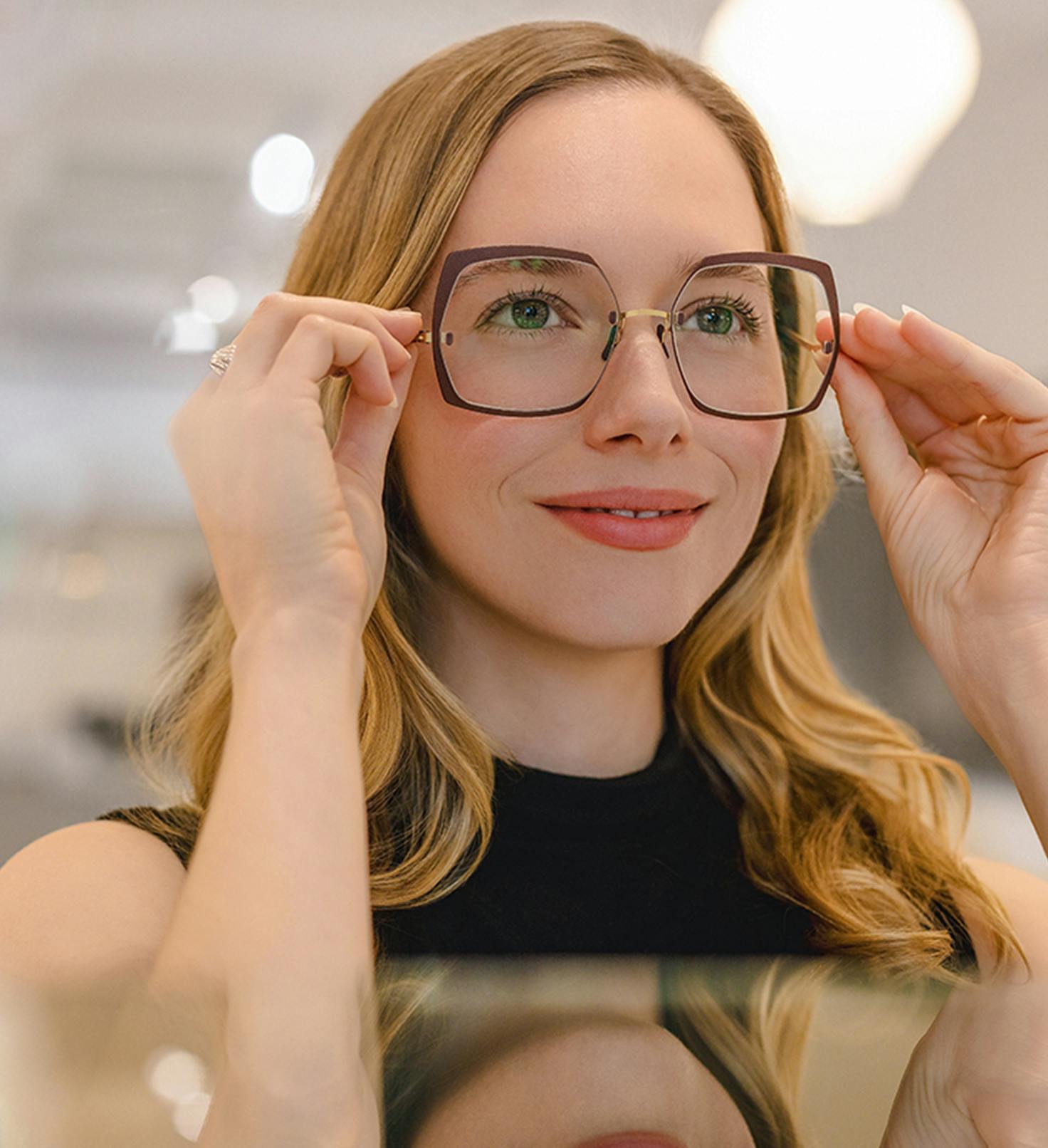 Woman with glasses smiling