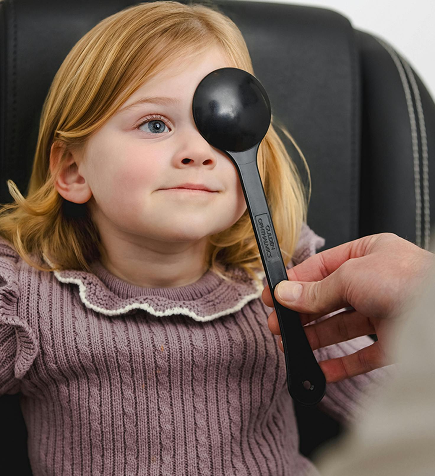 A child getting an eye exam done