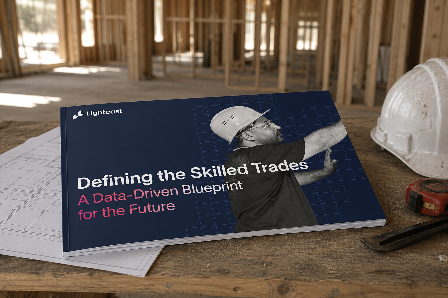 Lightcast's Defining the Skilled Trades report displayed on a construction workbench