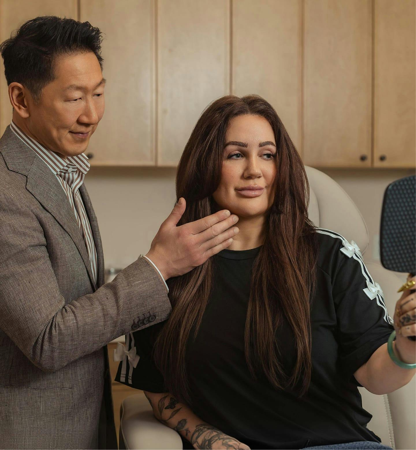 Dr. Philip Young with patient looking in mirror
