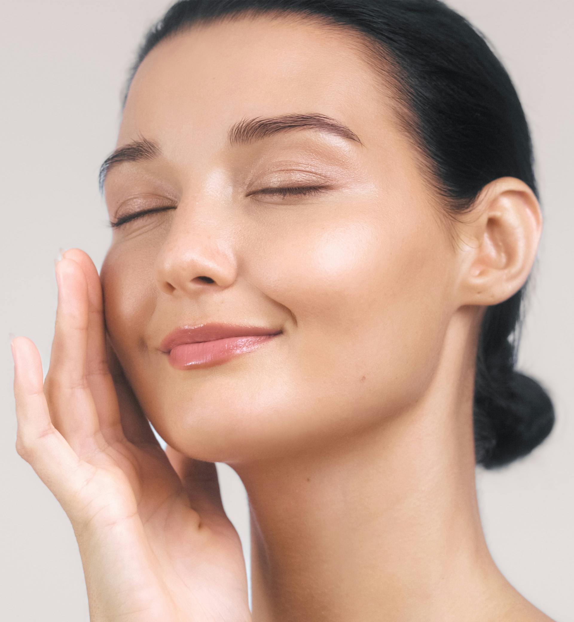 woman touching her face