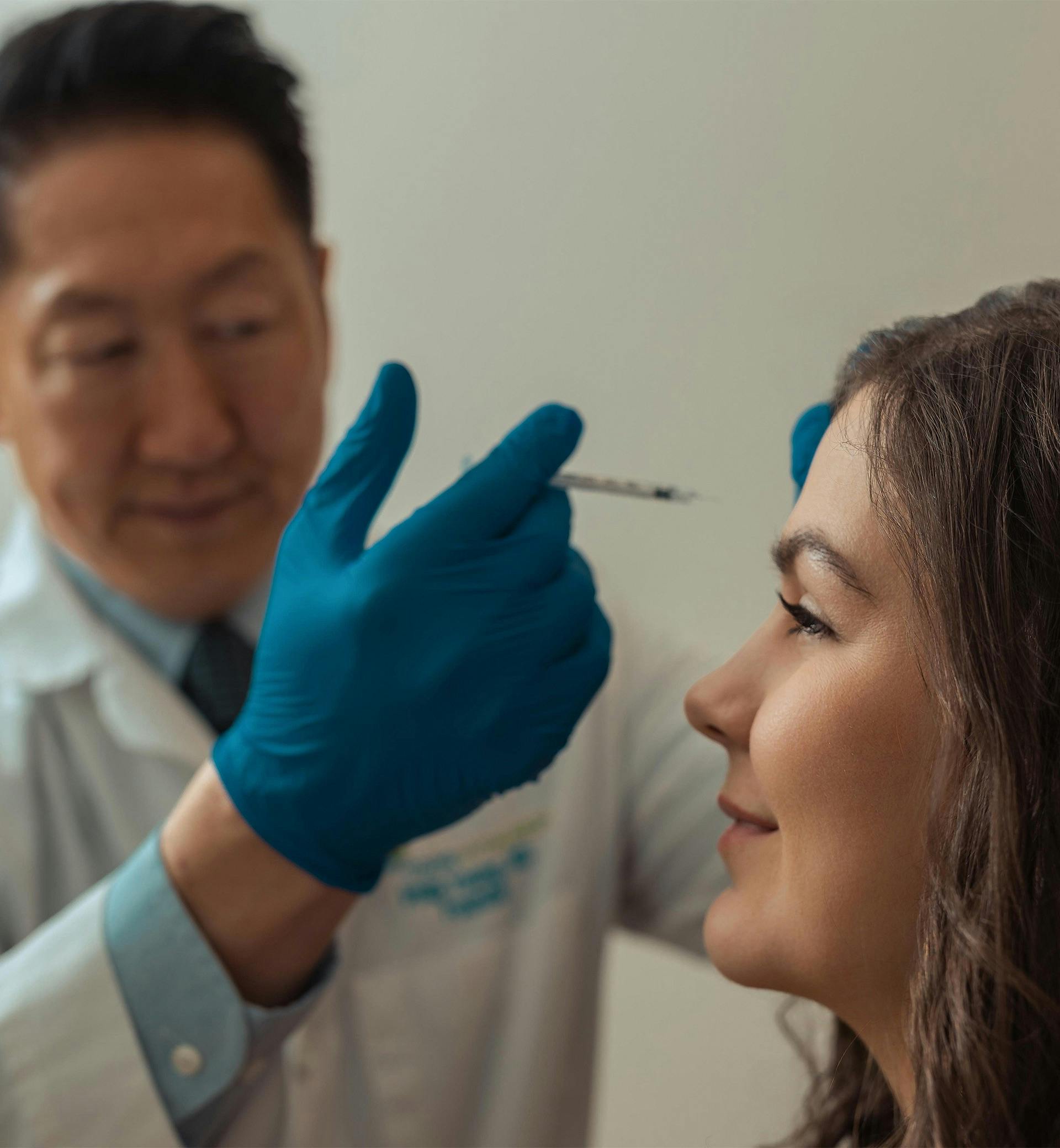 doctor injecting a patient