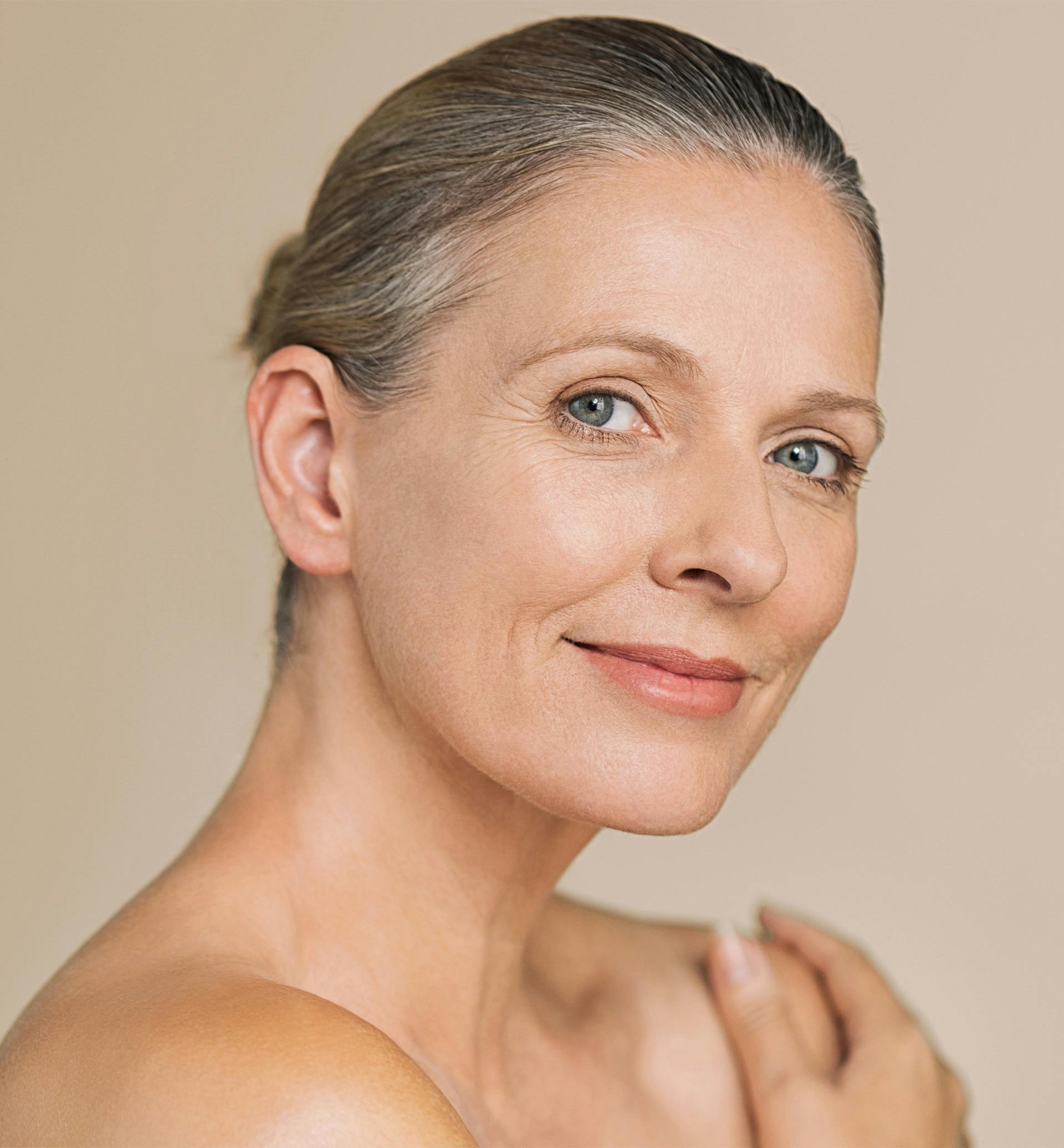 woman touching her shoulder