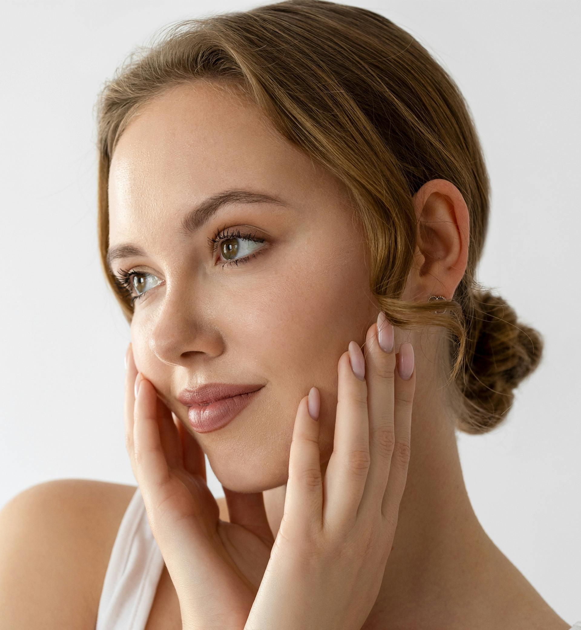 woman touching her face