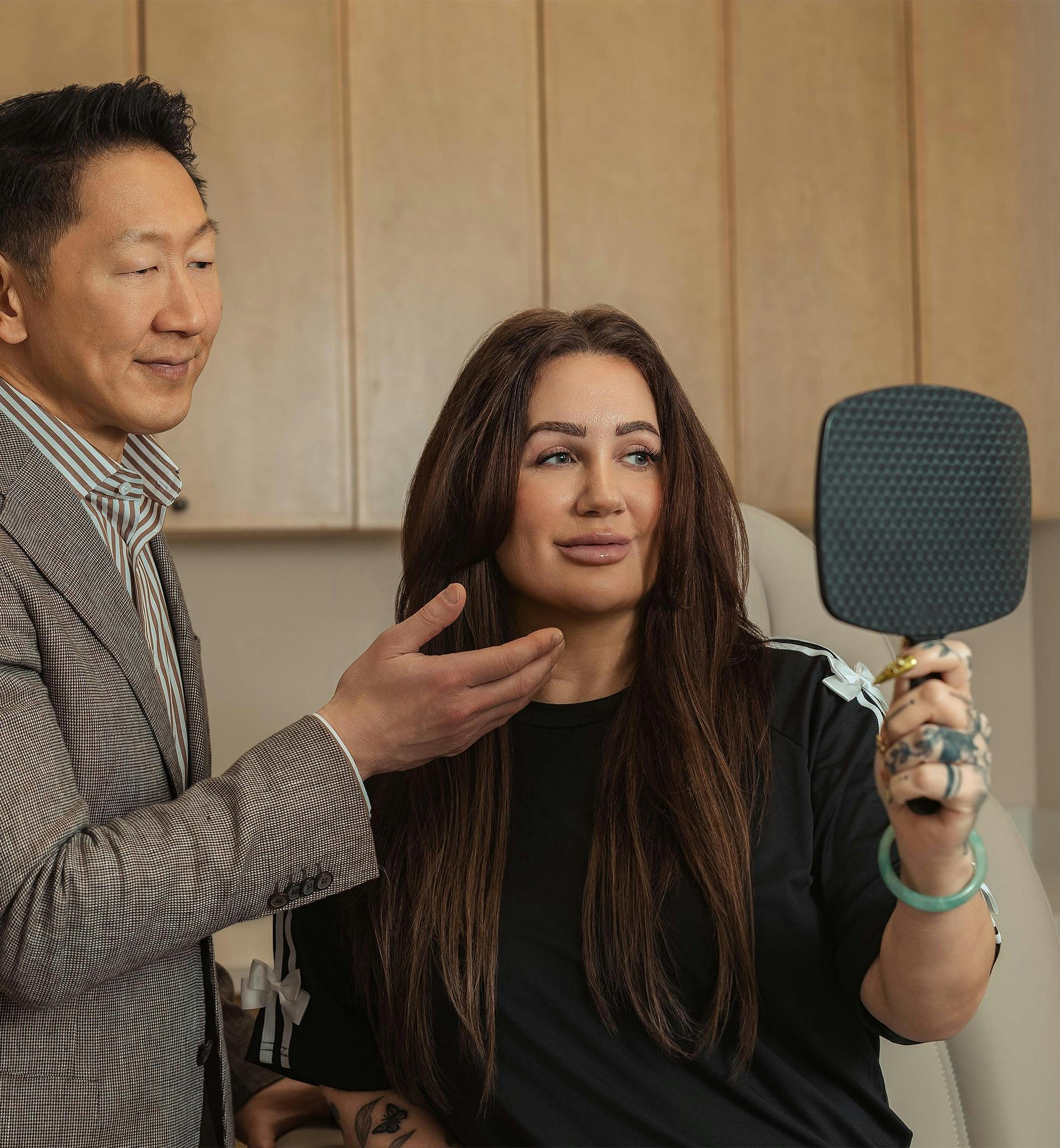 doctor showing a patient her face