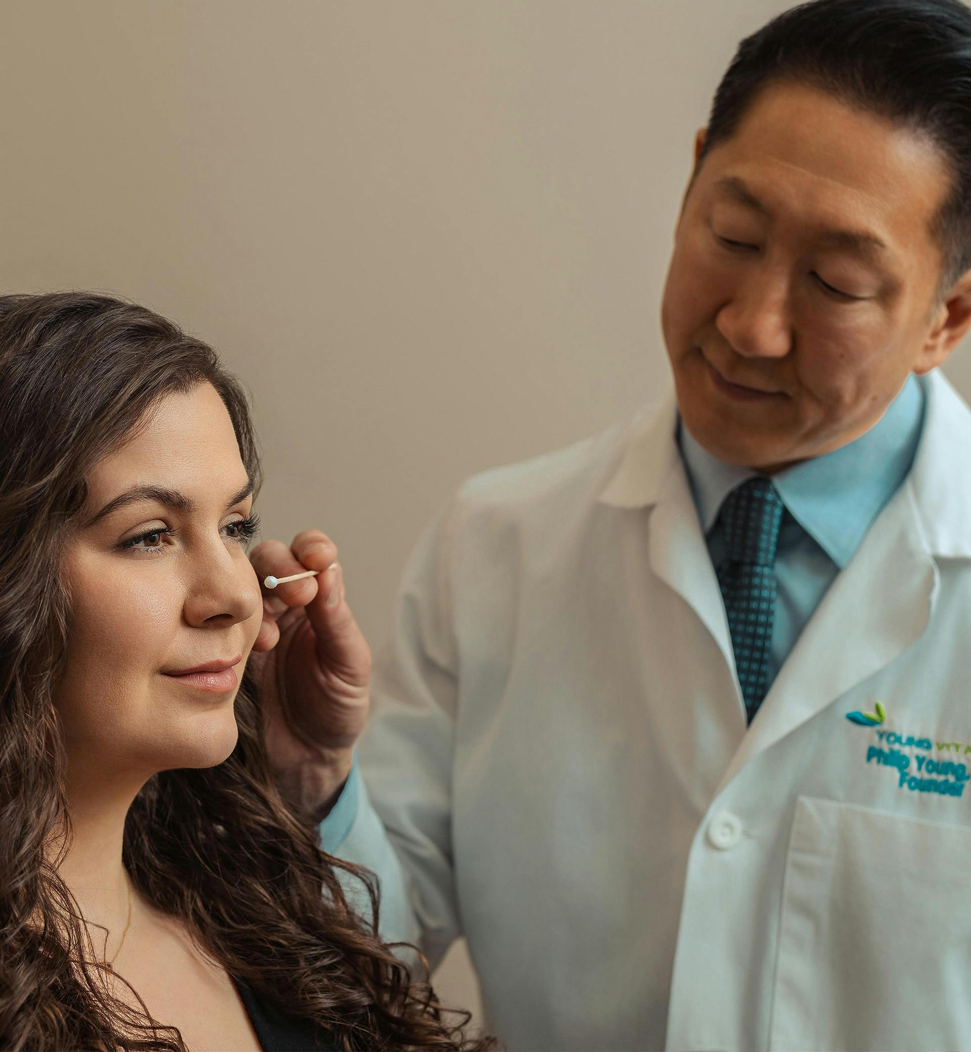 doctor looking at a patients face