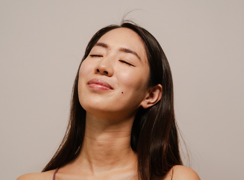woman closing her eyes