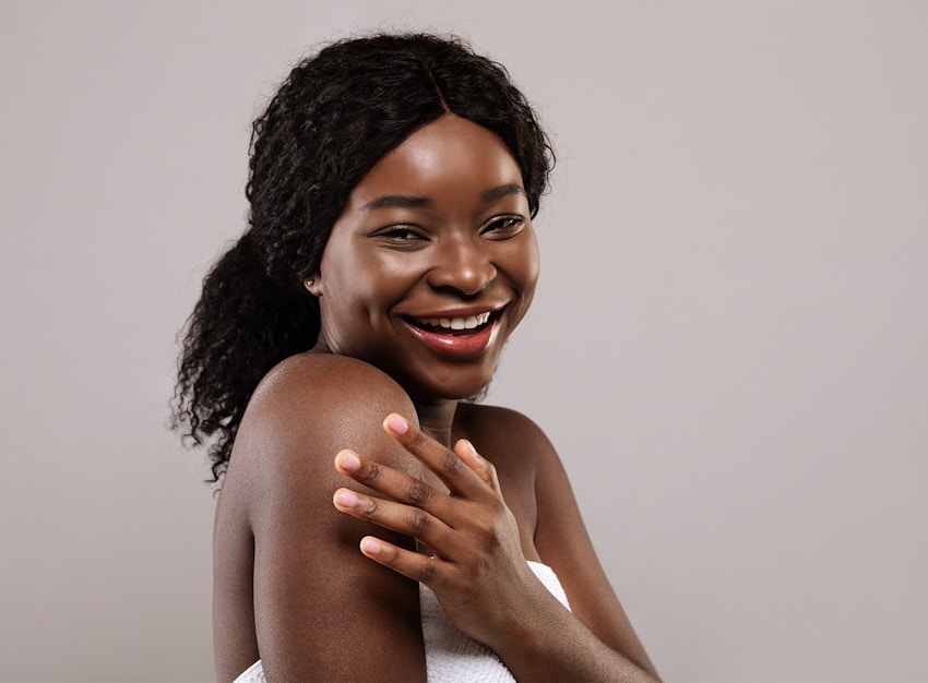 woman smiling over her shoulder