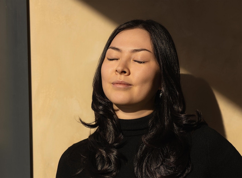 woman closing her eyes