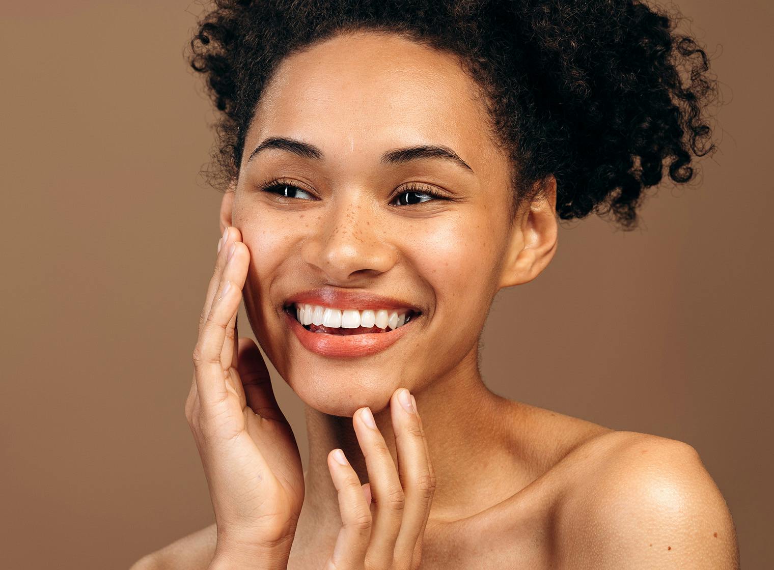 woman touching her face