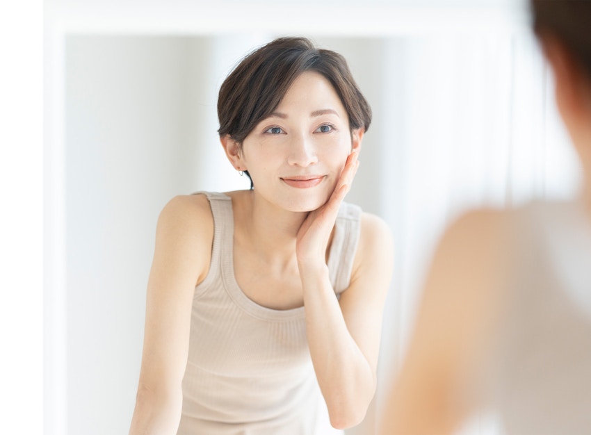 woman touching her face